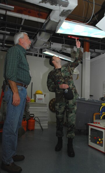 MOODY AIR FORCE BASE, Ga. --Terry Haney, 23rd Medical Group facility manager, speaks with Airman 1st Class Spencer Gallien, 23rd Wing Public Affairs, about the changes that are being made to the clinic here Nov. 9.  The Air Force awarded a $1.31 million reprieve to the 23rd Medical Group to revamp common areas, corridors, reception areas and pharmacy windows. (USAF photo by Senior Airman Angelita M. Lawrence)