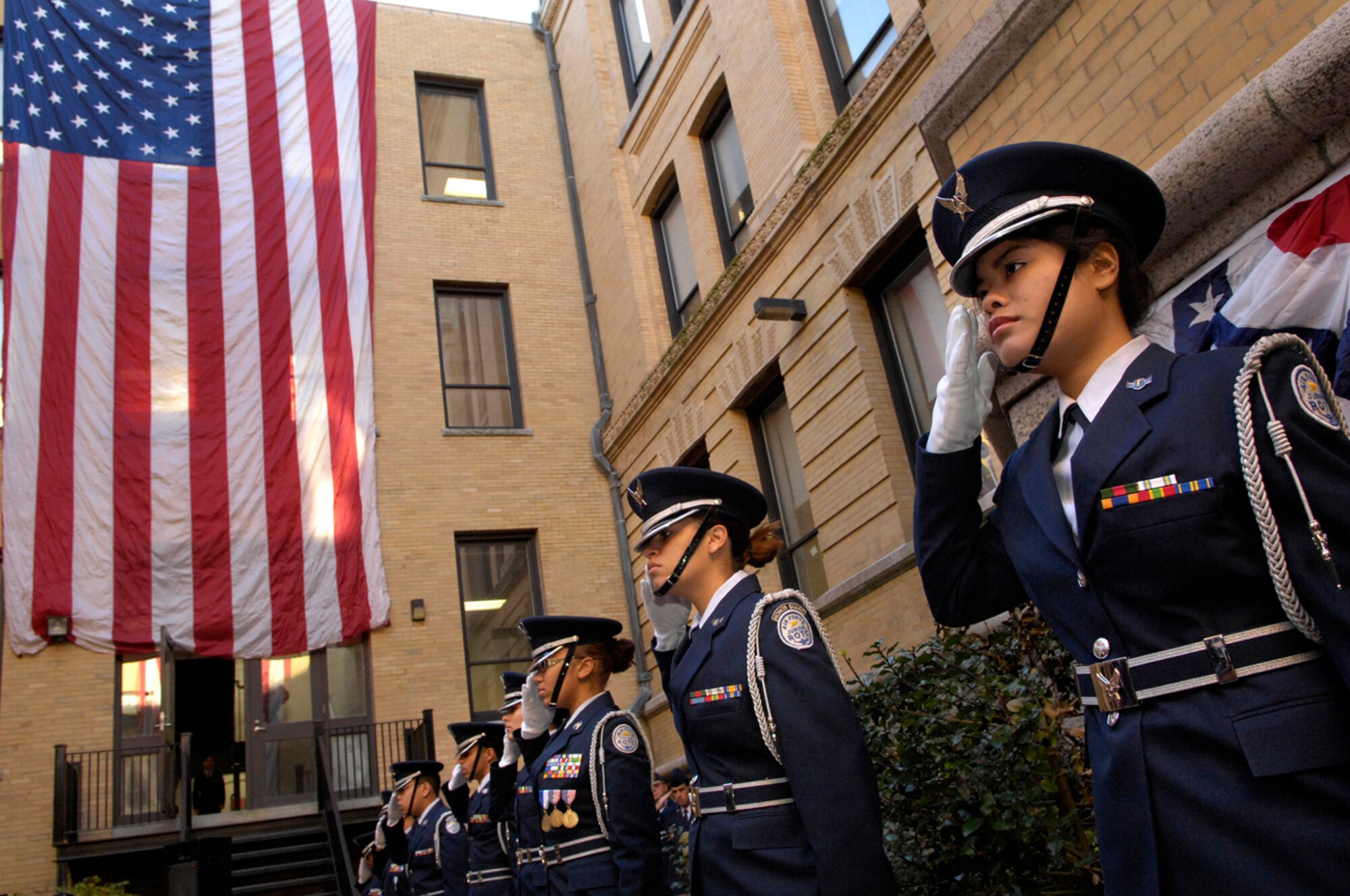 HANSCOM AFB, Mass. – From right, Air Force Junior ROTC MA-771 cadets Victoria Vann, Sasha Gonzales and Yomara Ramirez render salutes during the playing of the National Anthem. All three cadets are students at Lowell High School in Lowell Mass., which has the third largest Junior ROTC program in the nation. (U.S. Air Force photo by Mark Wyatt)