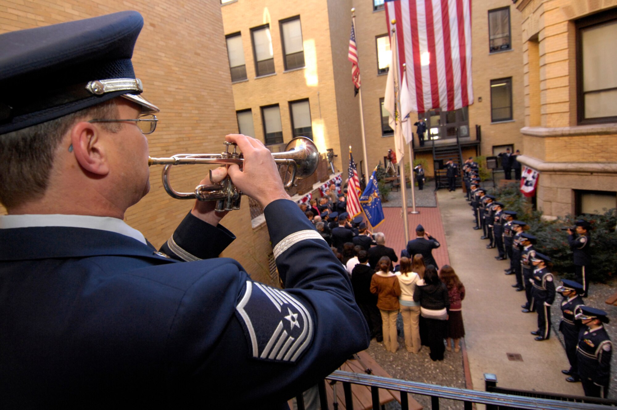 HANSCOM AFB, Mass. -- Master Sgt. Dave Arnold, Air Force Band of Liberty, plays Taps to honor fallen veterans during a Veterans Day remembrance event at Lowell High School in Lowell, Mass. The Nov. 8 event was hosted by the high school’s Air Force Junior ROTC unit, MA-771. (U.S. Air Force photo by Mark Wyatt)