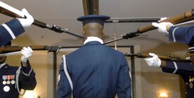 Staff Sgt. Theodore Miller of the U.S. Air Force Honor Guard stands at attention as four other members of the USAF Honor Guard drill team perform precision drill movements with their M1 Garand rifles with fixed bayonets during the Base Honor Guard Awards Ceremony at The Andrews Club on Oct. 30. (US Air Force/A1C Renae Kleckner)
