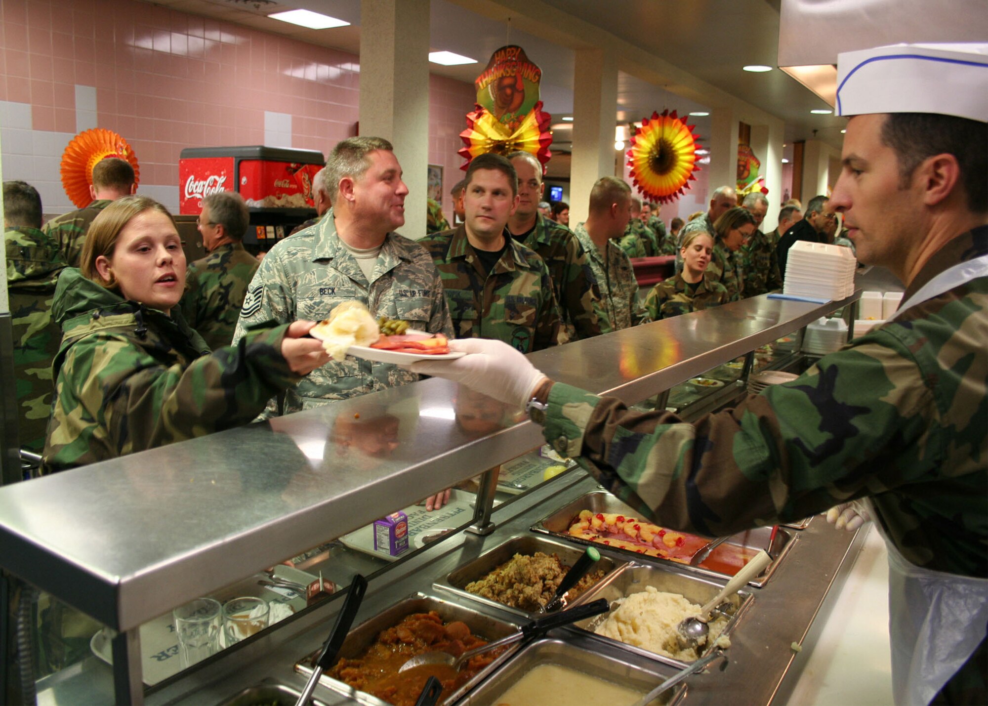 WRIGHT-PATTERSON AFB, Ohio - Maj Michael Brandenburg serves reservists during the lunchtime hour at the Pitsenbarger Dining Hall.  Commander's and First Sergeants serve airman at the dining hall during the November and December UTAs to show their appreciation for their service. (U.S. Air Force photo/Senior Airman Ken LaRock)