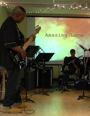Tech. Sgt. Keith Johnson, 341st Missile Security Forces Squadron assistant flight chief, and Airman Brad Turner, 341st Civil Engineer Squadron electrician apprentice, warm up prior to playing Christian music during a contemporary worship service Nov. 4 at the Detour. The Sunday service began in October and is held at 10 a.m. (U.S. Air Force photo/Airman 1st Class Dillon White)