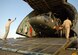 SAN ISIDRO AIR BASE, Dominican Republic -- The first of two Army UH-60 Black Hawk helicopters is unloaded from an Air Force C-5 Galaxy on the flight line here in preparation for medical relief missions.  American servicemembers deployed from Joint Task Force-Bravo at Soto Cano Air Base, Honduras, to assist the Dominican Republic after it was ravaged by Tropical Storm Noel.  (U.S. Air Force photo by Staff Sgt. Austin M. May)