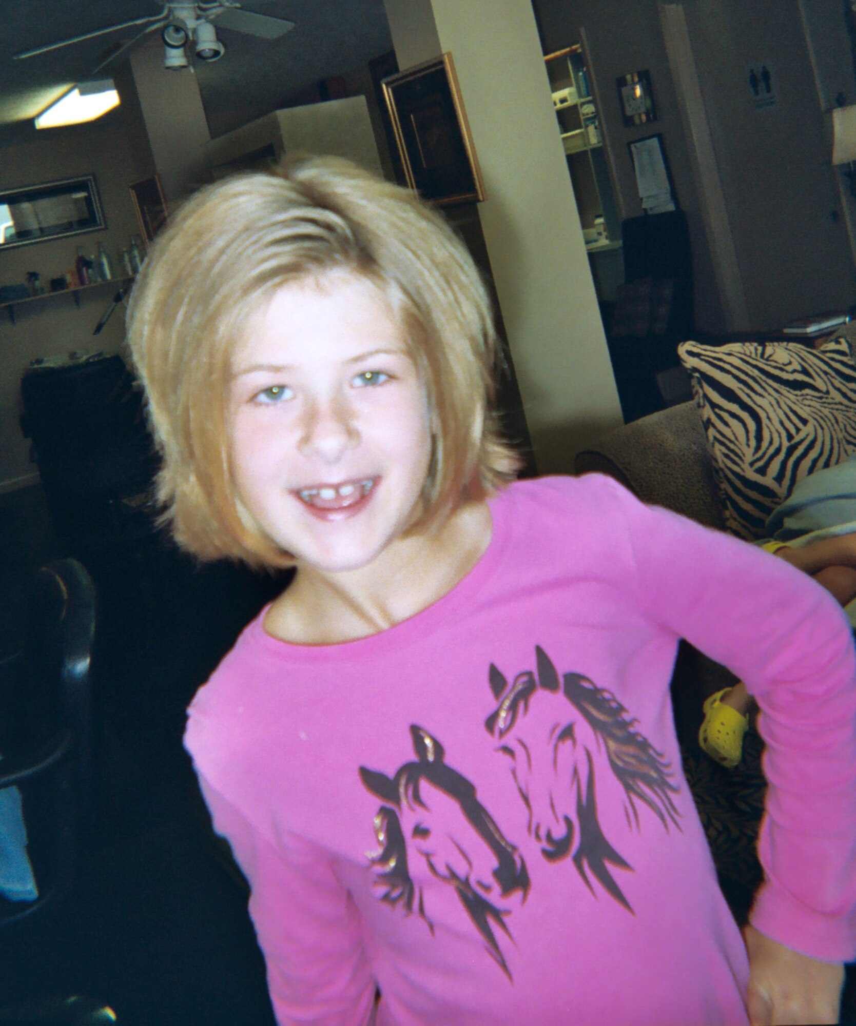 Katharine Omstead displays the end result of more than 10 inches of hair she got cut to donate to "Locks of Love," an organization that makes wigs from donated hair for cancer paitients.  (Courtesy photo)