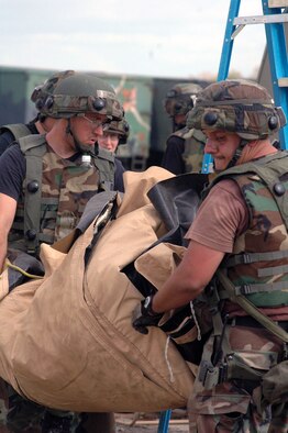 Airmen deployed to Air Force Exercise Eagle Flag 08-1 build a tent during operations for the exercise Oct. 23 at Naval Air Engineering Station Lakehurst, N.J.  The exercise, operated by the U.S. Air Force Expeditionary Center's 421st Combat Training Squadron, tests and trains Airmen in expeditionary combat support skill sets.  (U.S. Air Force Photo/Tech. Sgt. Scott T. Sturkol)