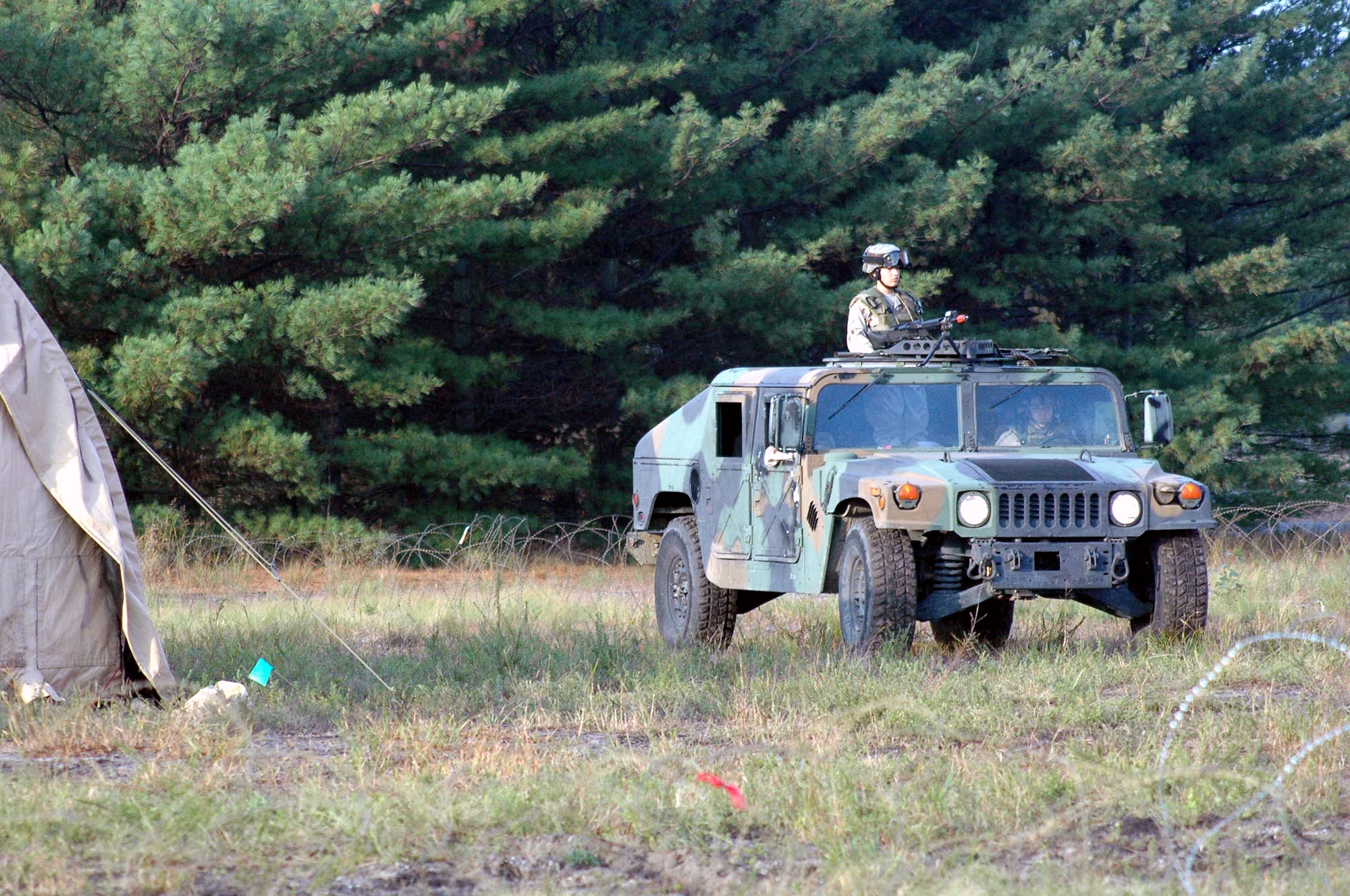Students in Air Force Phoenix Warrior Training Course 08-1 practice a patrol around the air expeditionary group encampment for Air Force Exercise Eagle Flag 08-1 at Naval Air Engineering Station Lakehurst, N.J., Oct. 23.  Phoenix Warrior is a contingency skills training course for Air Force security forces prior to deployment.  The course and the exercise the students were participating in are operated by the U.S. Air Force Expeditionary Center's 421st Combat Training Squadron at Fort Dix, N.J.  (U.S. Air Force Photo by Tech. Sgt. Scott T. Sturkol)