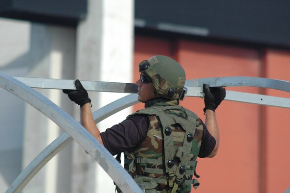 An Airman deployed to Air Force Exercise Eagle Flag 08-1 builds a tent in the air expeditionary group, or AEG, encampment during operations for the exercise Oct. 22 at Naval Air Engineering Station Lakehurst, N.J.  The exercise, operated by the U.S. Air Force Expeditionary Center's 421st Combat Training Squadron, tests and trains more than 400 Airmen in expeditionary combat support skill sets.  (U.S. Air Force Photo/Tech. Sgt. Scott T. Sturkol)