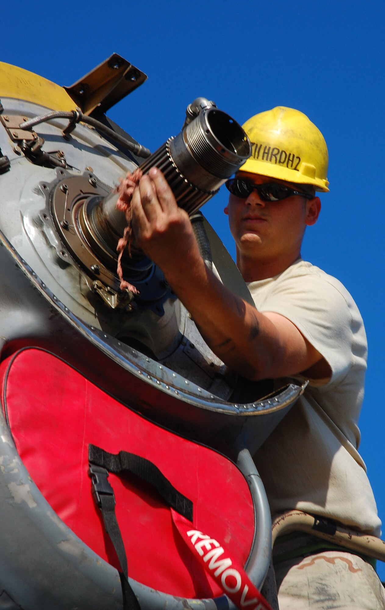 SOUTHWEST ASIA -- Staff Sgt. Paul Ratliff, 386th Expeditionary Aircraft Maintenance Squadron aerospace propulsion specialist, performs a propeller change Nov. 7 here. The propeller was replaced due to a hydraulic leak in the blade pump housing.  Sergeant Ratliff is deployed from Ramstein AB, Germany.  (U.S. Air Force photo by Staff Sgt. Tia Schroeder)
