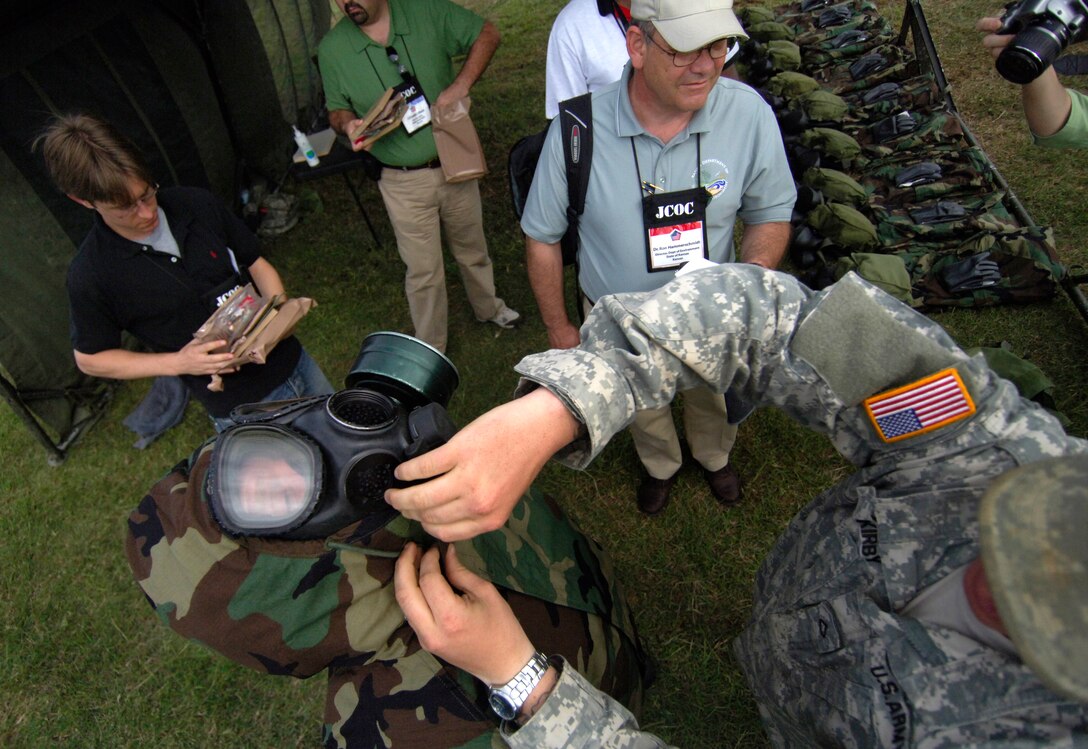 David J. Paladino, president of Landmark Group in Omaha, Neb., dons the new J-List chemical warfare ensemble during a 74th Joint Civilian Orientation Conference session on Kadena Air Base, Okinawa, Japan, Nov. 9, 2007.