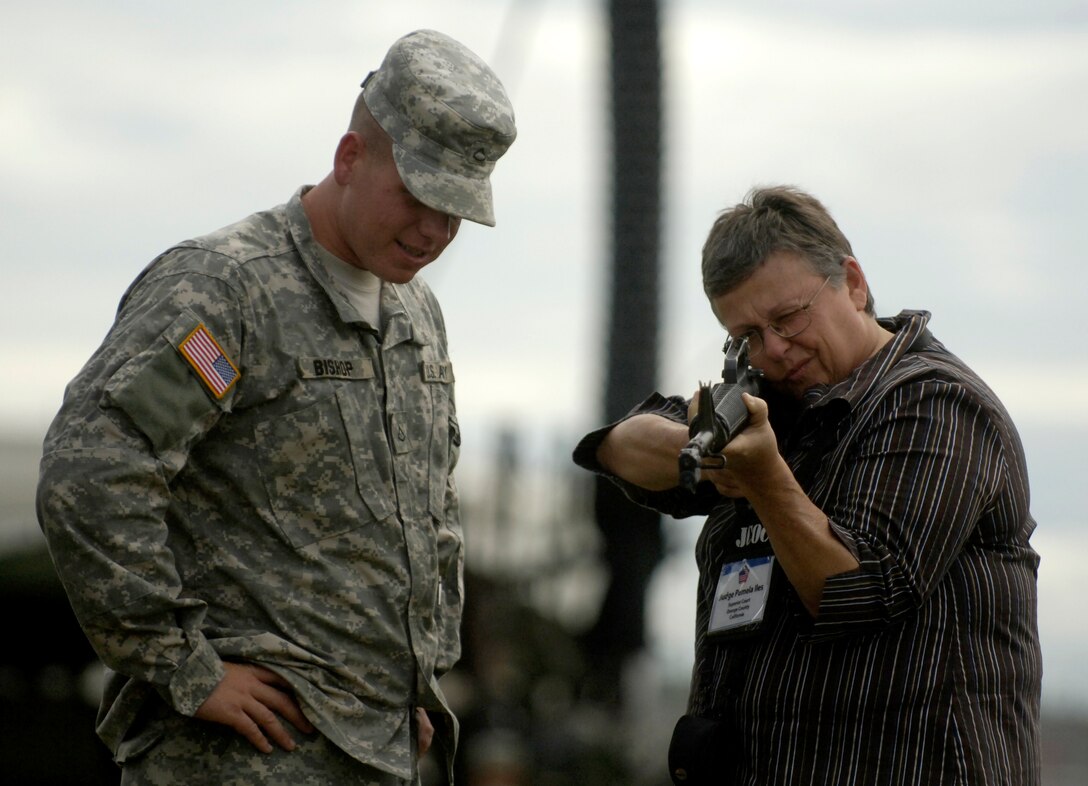 Pamela L. Iles, a superior court judge from Orange County, Calif., takes aim with a M16A2 rifle as part of the hands-on demonstration by soldiers of Delta Battery, 1st Battalion, 1st Air Defense Artillery Regiment, 94th Army Air and Missile Defense Command,on Kadena Air Base, Okinawa, Japan, during the 74th Joint Civilian Orientation Conference,  Nov.9, 2007.