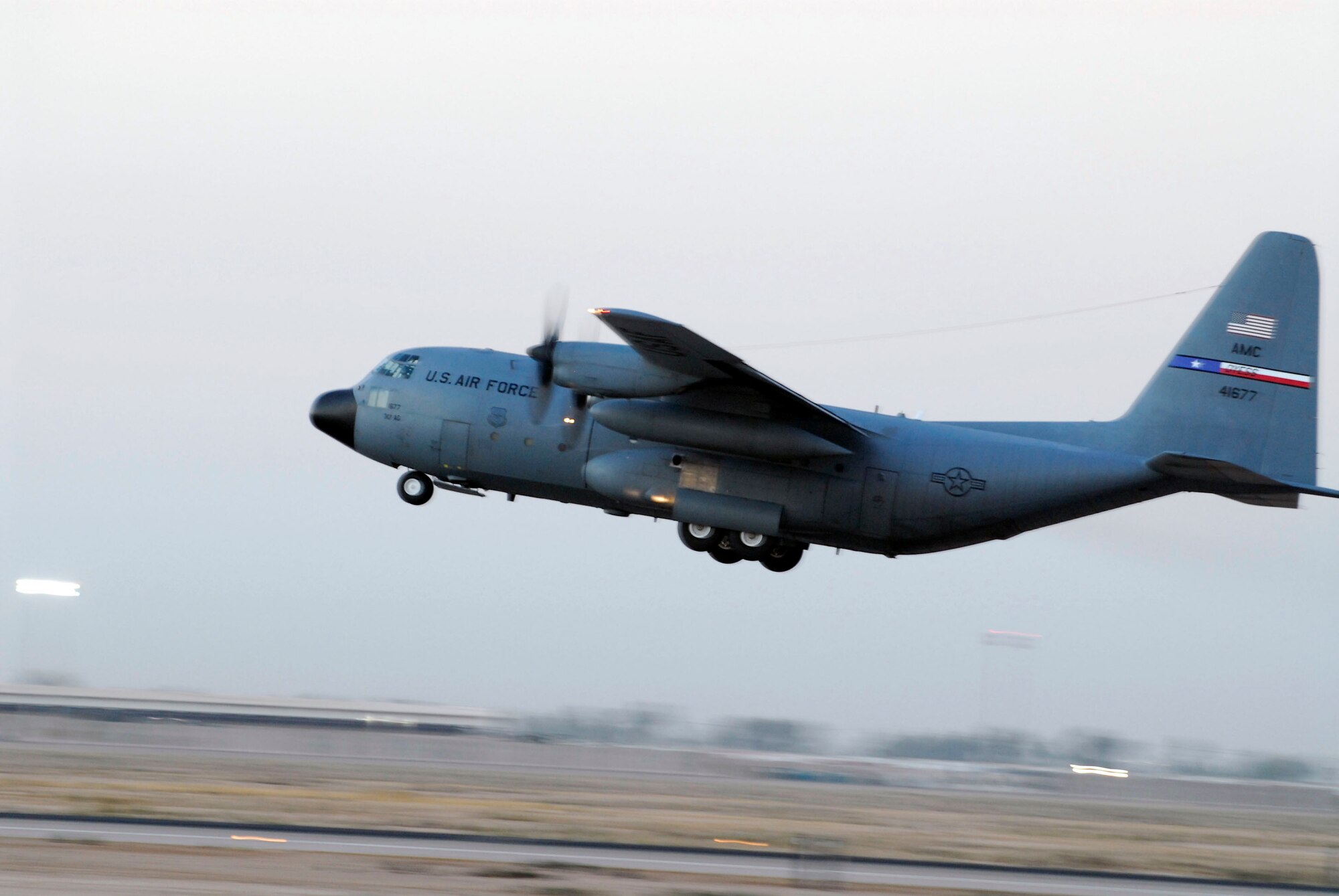 A C-130 Hercules from the 777th Expeditionary Airlift Squadron takes off at Balad Air Base, Iraq, Nov 11. The C-130 performs a variety of missions from transporting cargo and personnel to providing an airborne command post. (U.S. Air Force photo/Staff Sgt. Joshua Garcia)