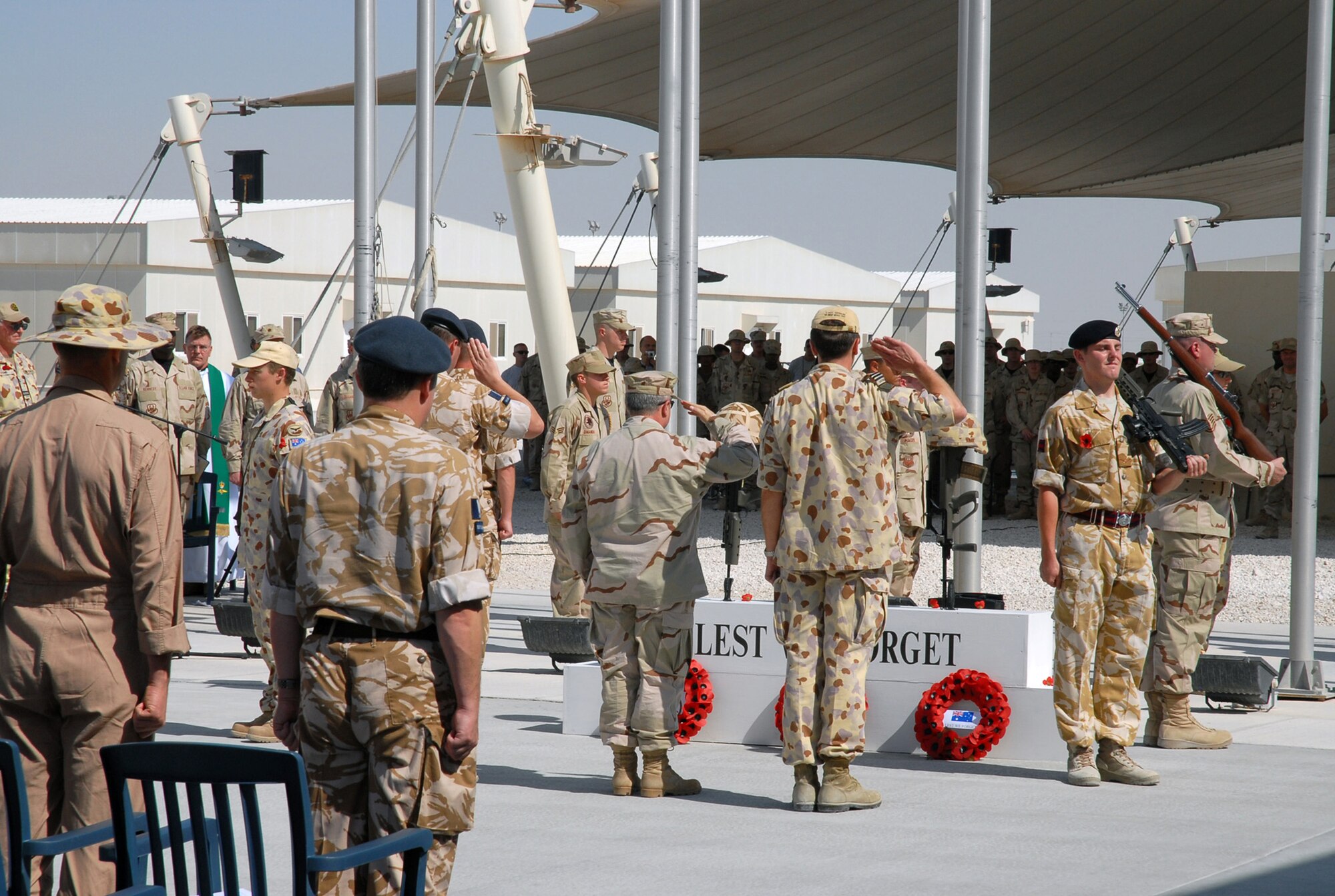 SOUTHWEST ASIA - Coalition forces from England, Australia and the United States gather to commemorate Remembrance Day and Veteran's Day Nov. 11, 2007 at a Southwest Asia air base. Prayers and invocations were delivered by chaplains from each country represented in various denominations. Wreaths were laid at the memorial by representatives of the countries. (U.S. Air Force photo/Staff Sgt. Douglas Olsen)
