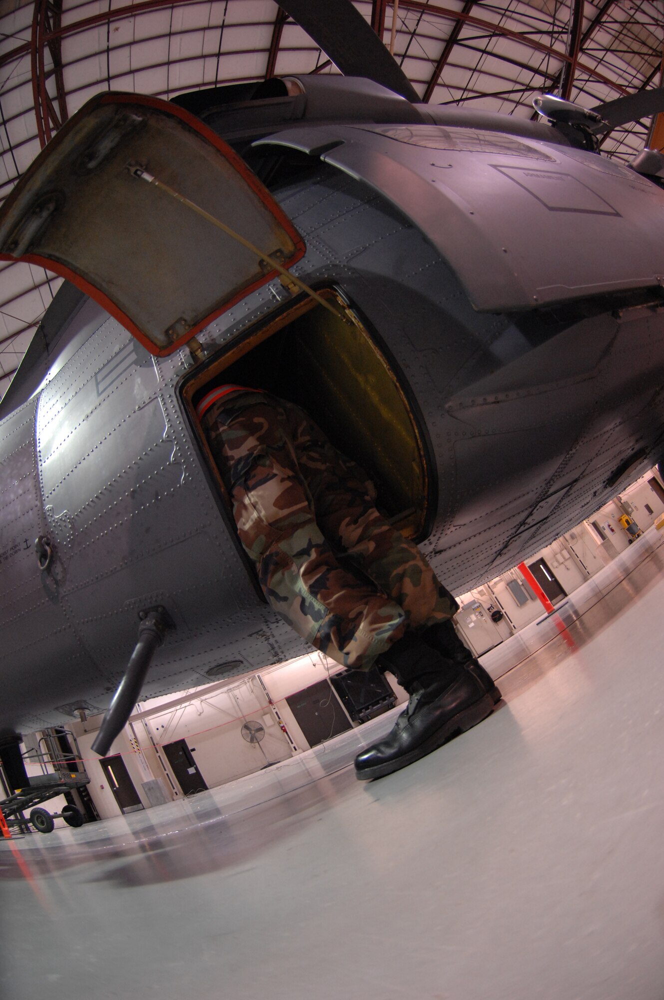 An Airman from the 23rd Equipment Maintenance Squadron inspects an inner
compartment of the HH-60G Pave Hawk helicopter Oct. 31 at Moody Air Force
Base, Ga. The aircraft was impounded after suffering an in-flight control
issue. (U.S. Air Force photo by Senior Airman Elizabeth Rissmiller) 
