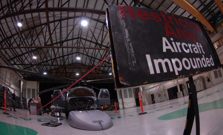 Airmen from the 23rd Equipment Maintenance Squadron work on an impounded
HH-60G Pave Hawk helicopter on Oct. 31, at Moody Air Force Base, Ga. The
aircraft was impounded after suffering an in-flight control issue. (U.S. Air
Force photo by Senior Airman Elizabeth Rissmiller) 
