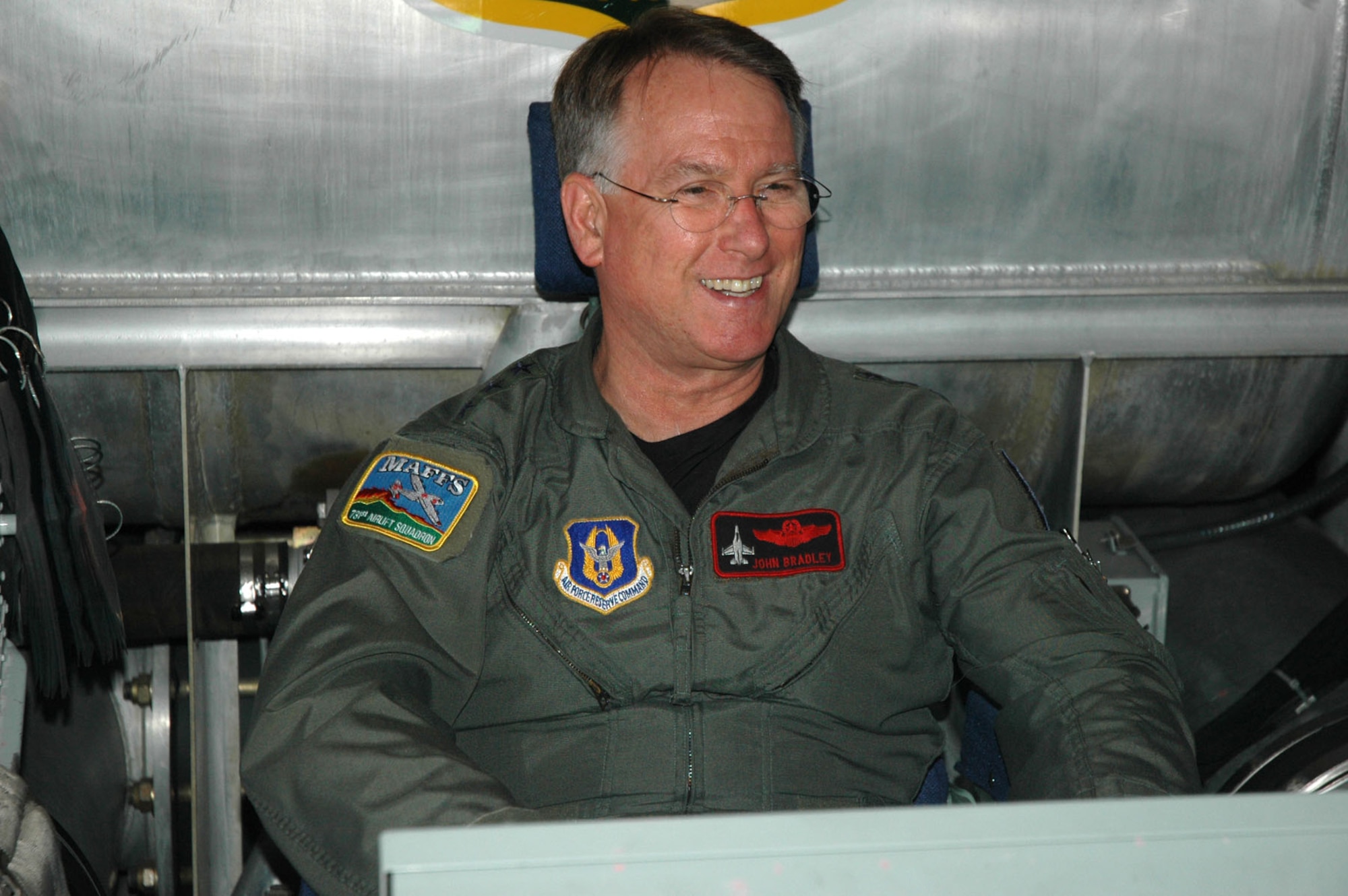 Lt. Gen. John Bradley, Chief of Air Force Reserve and Air Force Reserve Command commander, gets comfortable at the controls of a Modular Airborne Firefighting System Nov. 6, 2007 at Peterson Air Force Base, Colo.  General Bradley toured a MAFFS equipped C-130 while also thanking Reservists from the 302nd Airlift Wing for their efforts in helping to contain wildfires in southern California last month.      