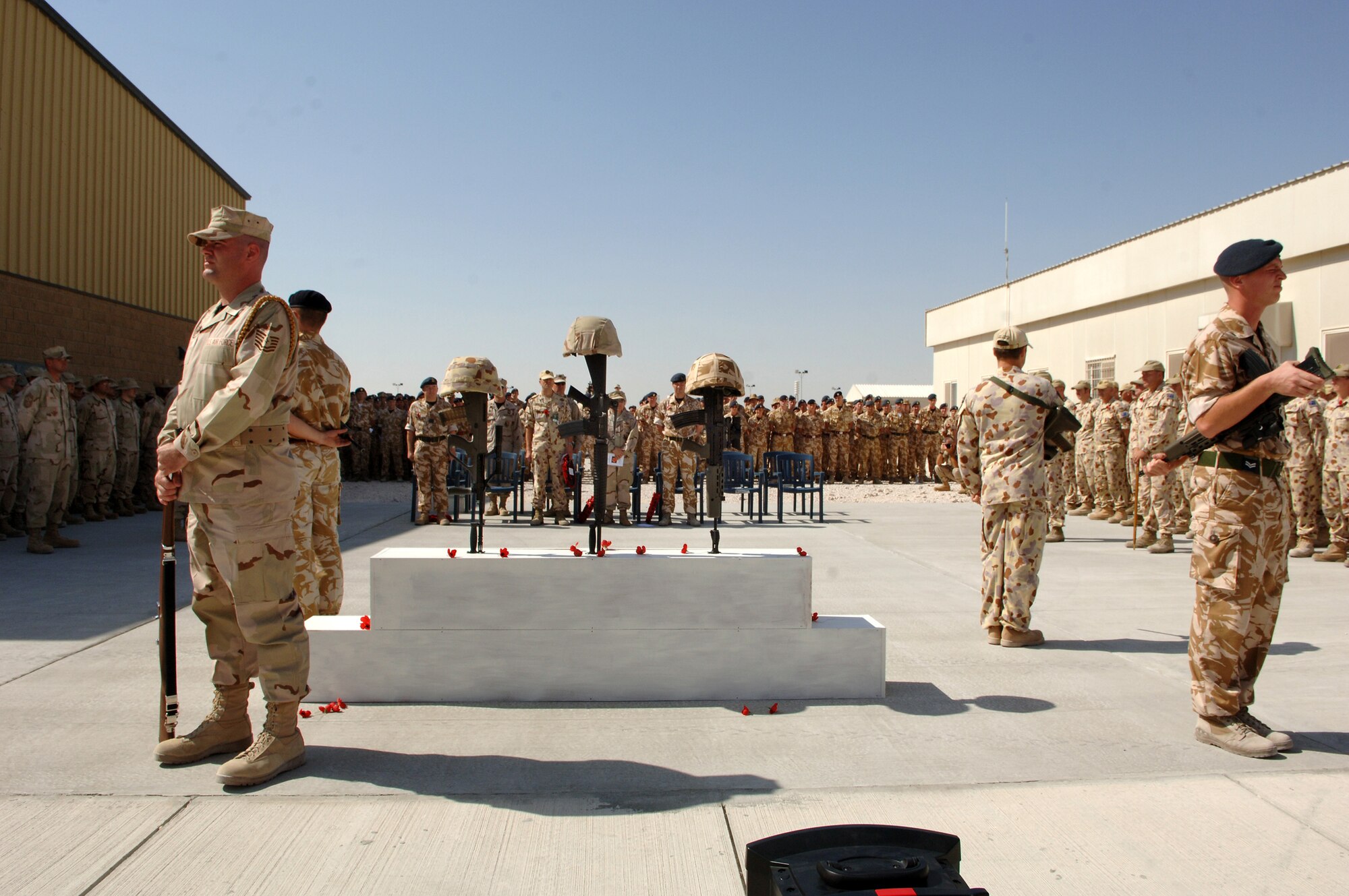 SOUTHWEST ASIA - Coalition forces from England, Australia and the United States gather to commemorate Remembrance Day and Veteran's Day Nov. 11 at a Southwest Asia air base. Prayers and invocations were delivered by chaplains from each country represented in various denominations. (U.S. Air Force photo/ Master Sgt. Greg Kunkle)



(Air Force Photo by Master Sergeant Greg Kunkle)