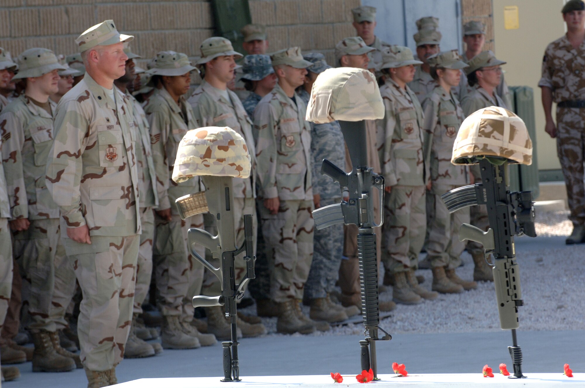 SOUTHWEST ASIA - Coalition forces from England, Australia and the United States gather to commemorate Remembrance Day and Veteran's Day Nov. 11 at a Southwest Asia air base. Prayers and invocations were delivered by chaplains from each country represented in various denominations. Wreaths were also laid at the memorial by representatives of the countries. (U.S Air Force photo/Master Sgt. Greg Kunkle)



(Air Force Photo by Master Sergeant Greg Kunkle)