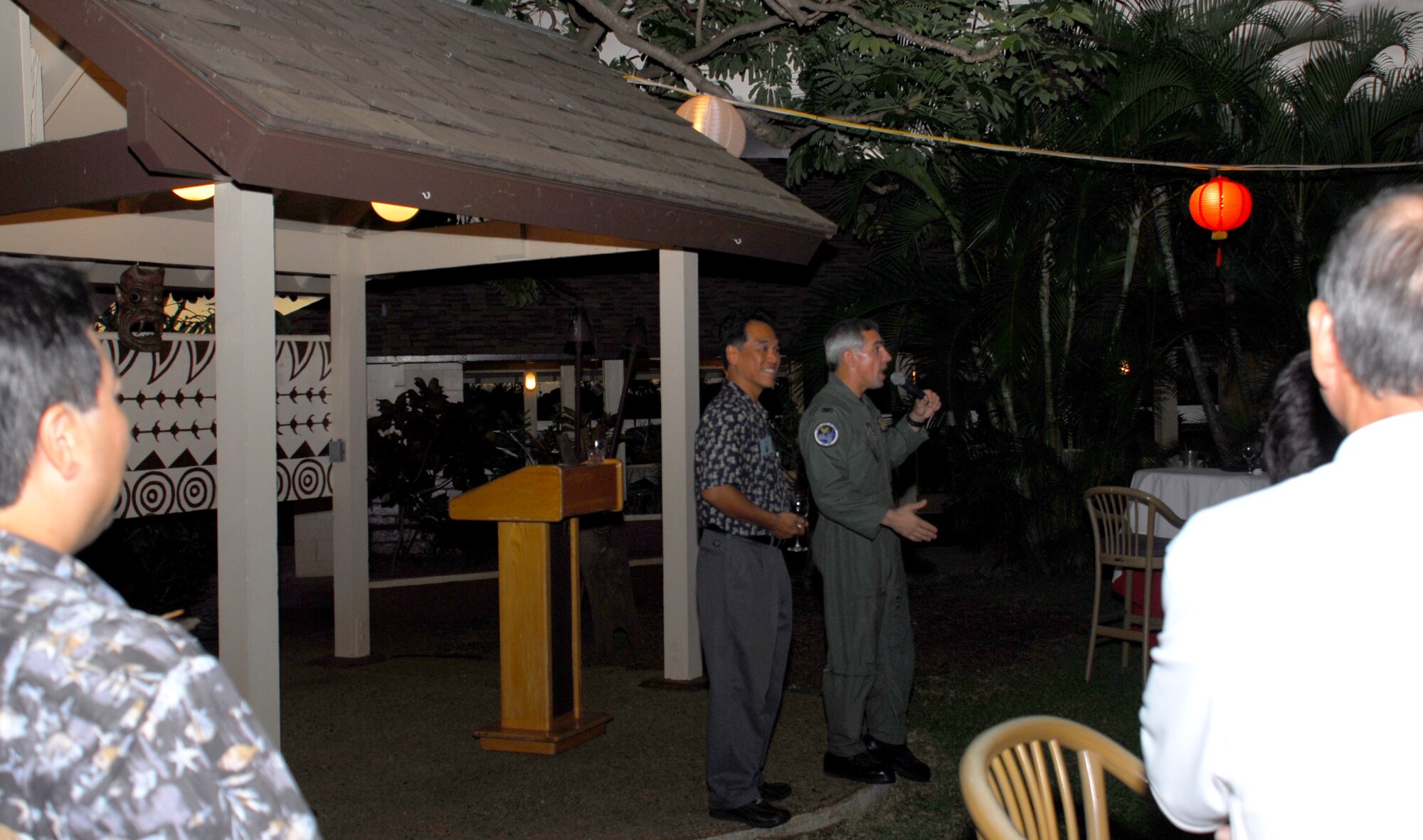 Col. J.J. Torres, 15th Airlift Wing commander, and Lindbergh Marzo, Friends of Hickam president talk to group and squadron commanders and Friends of Hickam members about the significance of Friends of Hickam, at a reception at the Officer's Club, Nov. 8 after the C-17 orientation flight.