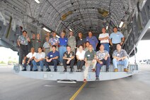 Friends of Hickam members pose for a picture before a C-17 orientation flight and reception. 