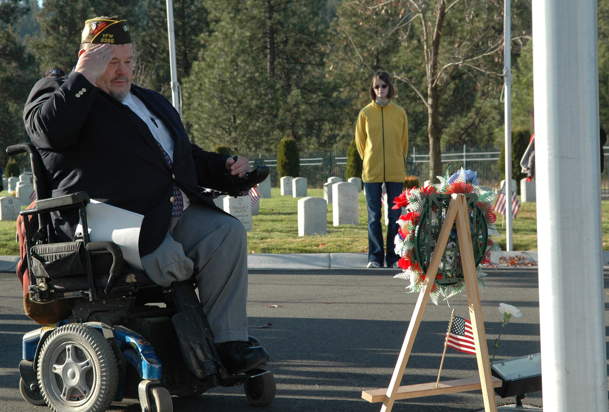 FAIRCHILD AIR FORCE BASE, Wash. -- Walt Mabe, Veterans of Foreign War Horton/Strength Post 3386 post commander, gives a final salute in respect for all of the men and women in uniform that have given their lives in support of their country during a Veterans Day ceremony Nov. 11. Mr. Mabe placed a small American flag at the base of the wreath before giving his salute. A veteran himself, Mr. Mabe put the ceremony together, which Post 3386 has been doing since 1984. (U.S. Air Force photo / Tech. Sgt. Larry W. Carpenter Jr.)