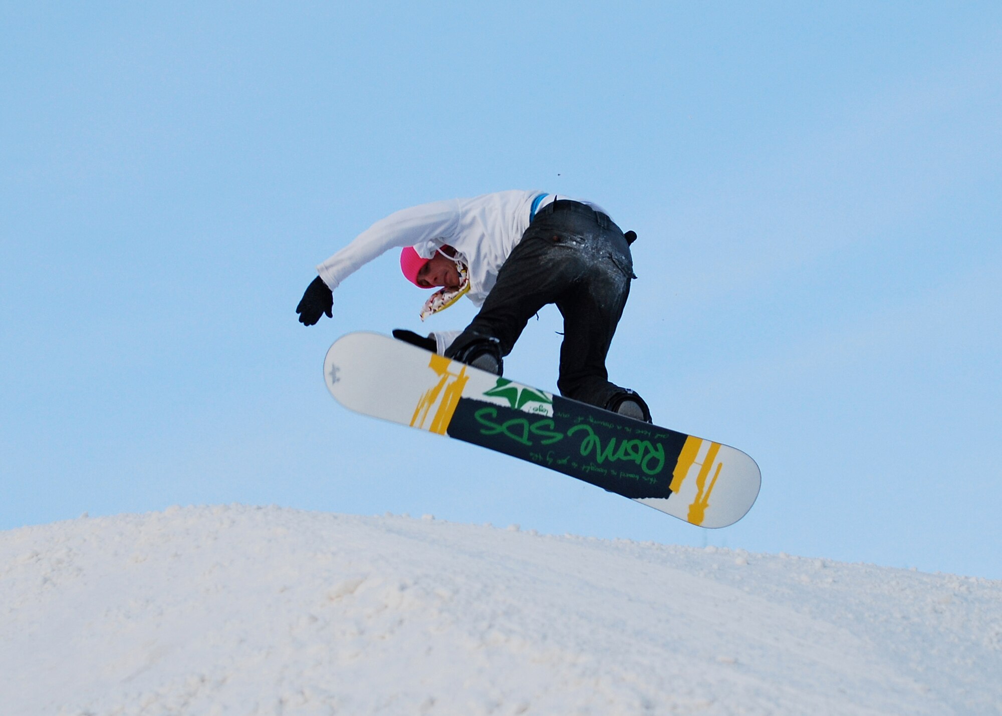 EIELSON AIR FORCE BASE, Alaska-- Senior Airman Mark Eidschun, 354th Aircraft Maintenance Squadron crew chief, does a 180-degree turn mid-air Nov. 11 during Birch Hill's opening weekend. Birch Hill is the local skiing and snowboarding recreational area, located at Fort Wainwright. Other events held at Birch Hill are tubing and skeet shooting. (U.S. Air Force photo by Airman 1st Class Chase Doyel)