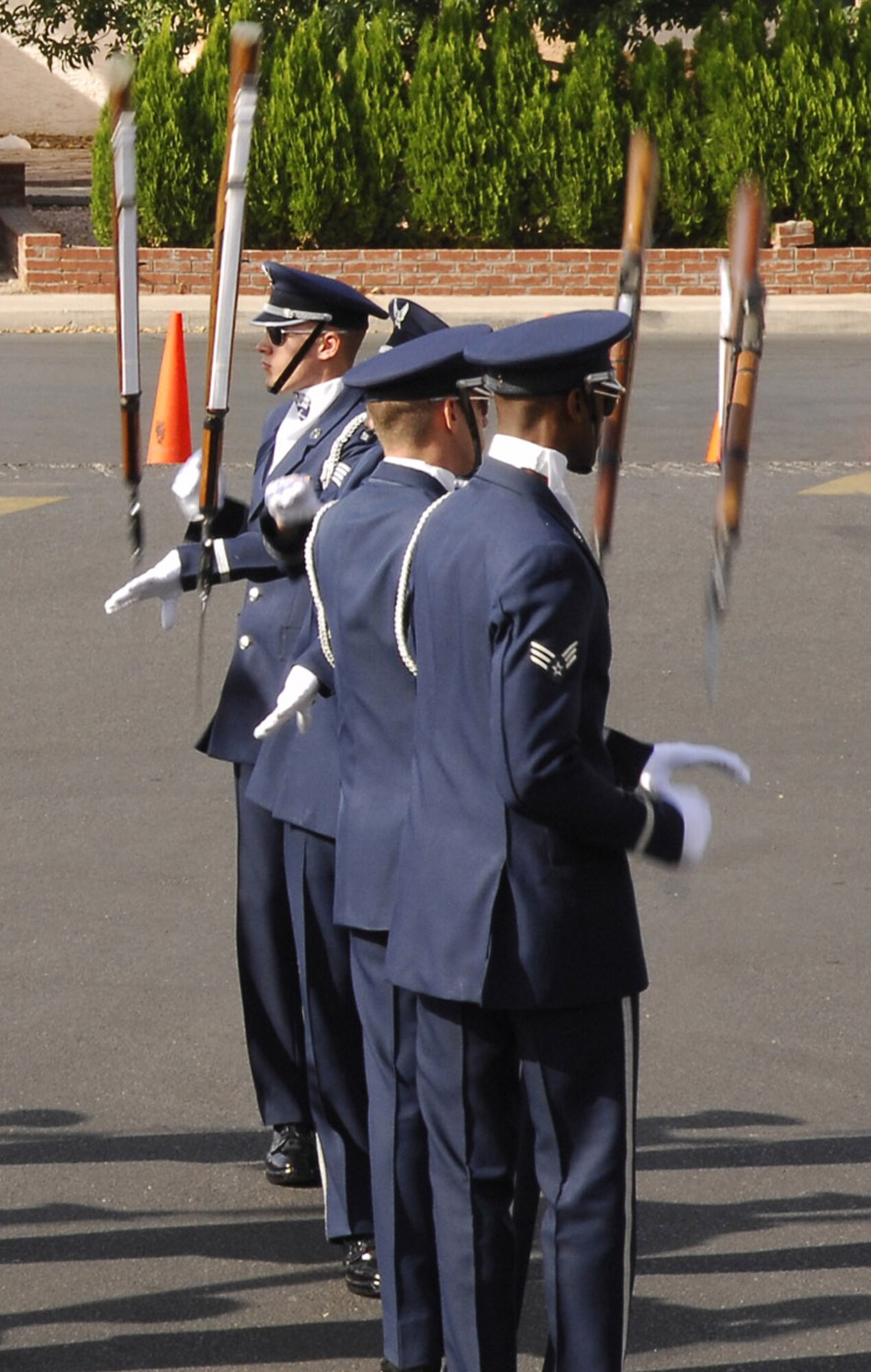 Members of the Air Force Honor Guard drill team perform at the John F. Miller School for Special Needs Nov. 8 in Las Vegas. The drill team planned a special performance for the students at the school during their visit to the city and Nellis Air Force Base, Nev., for the final week of the Air Force's 60th Anniversary celebrations. (U.S. Air Force photo/Airman 1st Class Alexander Montes) 
