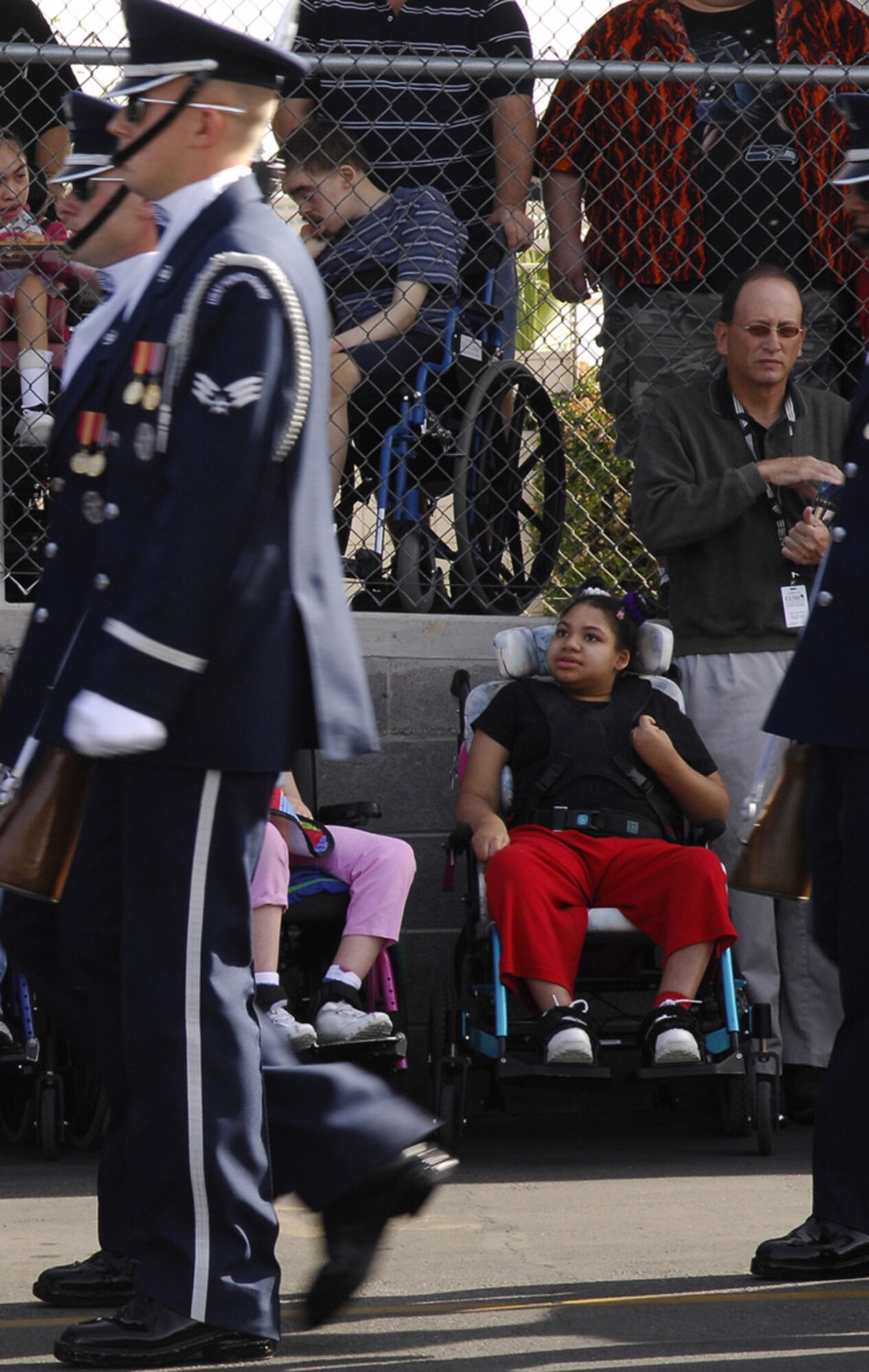 Members of the Air Force Honor Guard drill team perform at the John F. Miller School for Special Needs Nov. 8 in Las Vegas. The drill team planned a special performance for the students at the school during their visit to the city and Nellis Air Force Base, Nev., for the final week of the Air Force's 60th Anniversary celebrations. (U.S. Air Force photo/Airman 1st Class Alexander Montes) 
