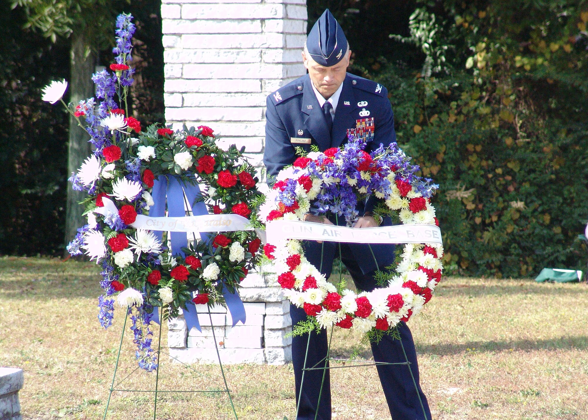 EGLIN AIR FORCE BASE, Fl. -- Col. Eric Pohland, 96th Air Base Wing commander, places a wreath at the Veteran's Memorial during a ceremony at Doolittle Park in Valparaiso Nov. 11. (Photo by Minty Knighton)