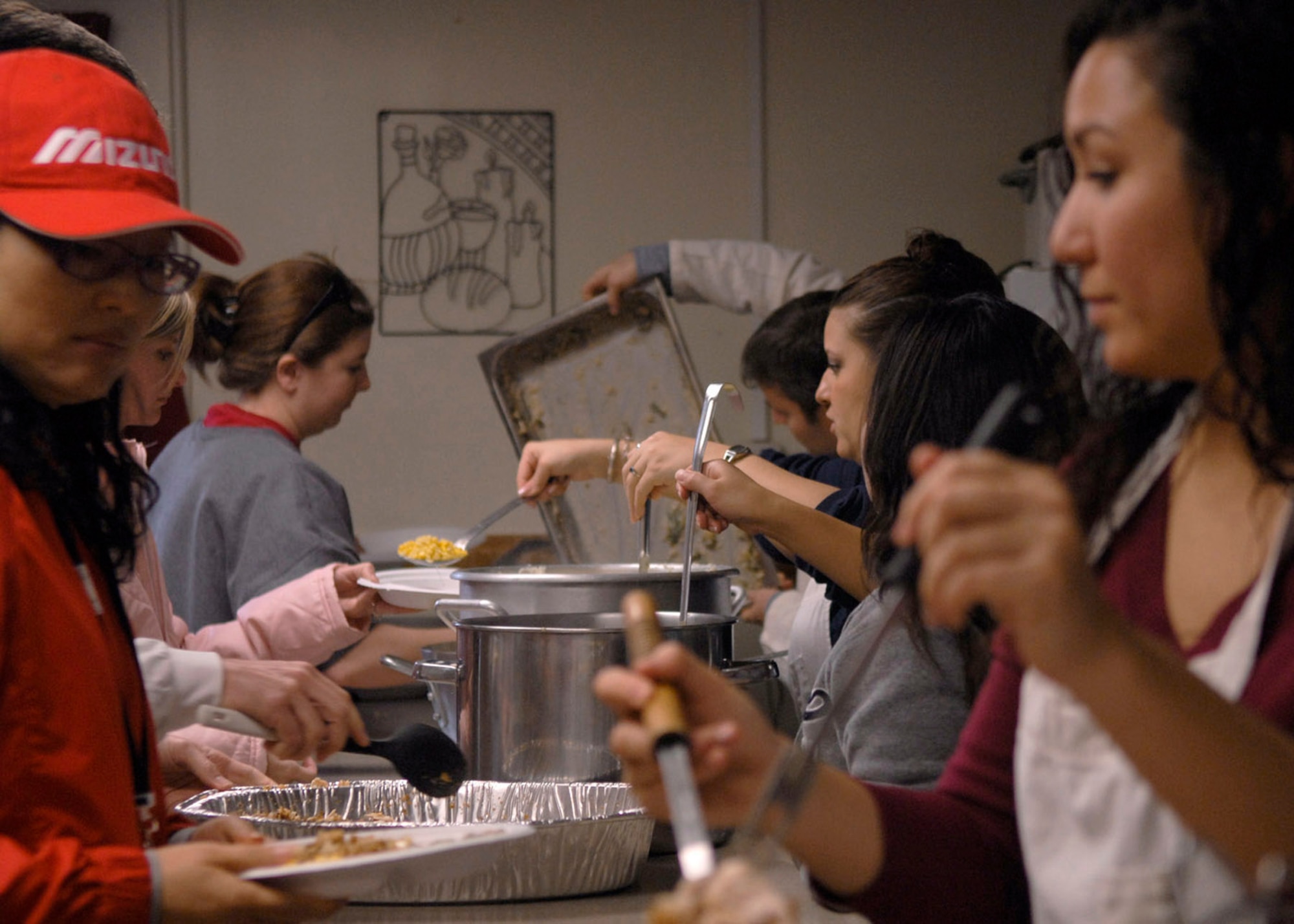 Airmen from the 8th Fighter Wing prepare Thanksgiving meals for 60 disabled South Koreans at the Sonlight Inn Nov. 10 at Kunsan Air Base, South Korea. Airmen held a day of games and food for the local nationals. (U.S. Air Force photo/Staff Sgt. Araceli Alarcon)