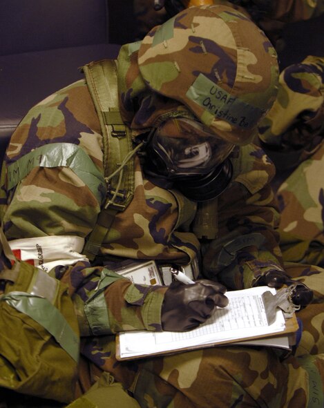 Tech. Sgt. Christine Bellinghiere documents a patient's condition during a simulated cardiac arrest during the Peninsula Operational Readiness Exercise Nov. 7 at Kunsan Air Base, South Korea. The exercise is conducted to ensure base members remain ready to execute its mission. Sergeant Bellinghiere is assigned to the 8th Medical Operations Squadron. (U.S. Air Force photo/Senior Airman Steven R. Doty) 