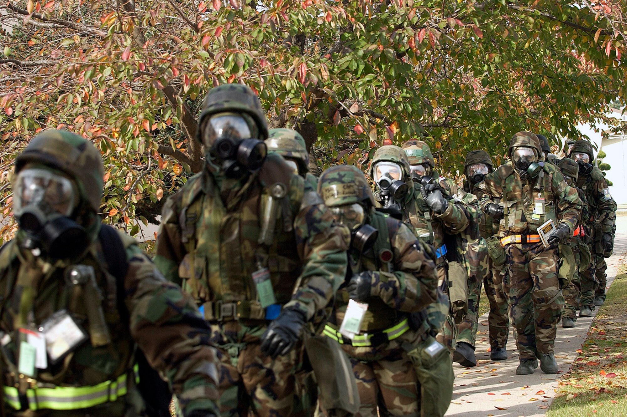 Members of the 8th Fighter Wing staff leave their designated area for a more secure location during the Peninsula Operational Readiness Exercise Nov. 6 at Kunsan Air Base, South Korea. The exercise tests the wing's ability to train and work in real-world situations. (U.S. Air Force photo/Senior Airman Giang Nguyen)
