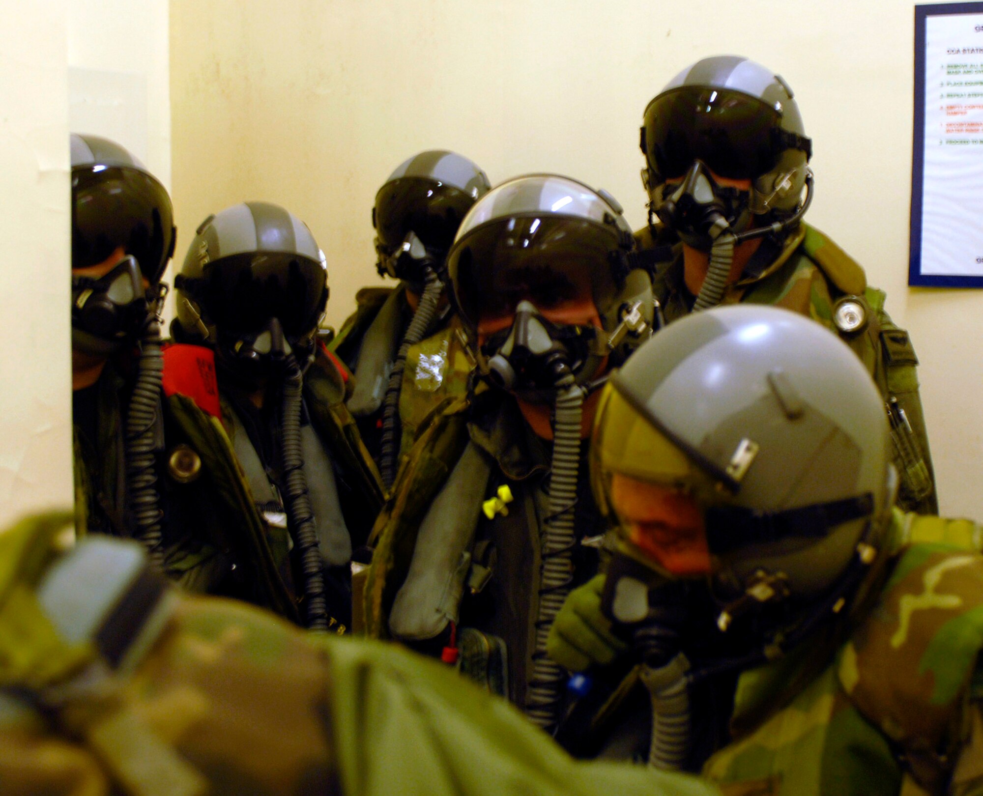Pilots with the 80th Fighter Squadron stand by prior to going to their F-16 Fighting Falcons during the Peninsula Operational Readiness Exercise Nov. 6 at Kunsan Air Base, South Korea. The exercise tests the wing's ability to train and work in real-world situations. (U.S. Air Force photo/Senior Airman Steven R. Doty) 

