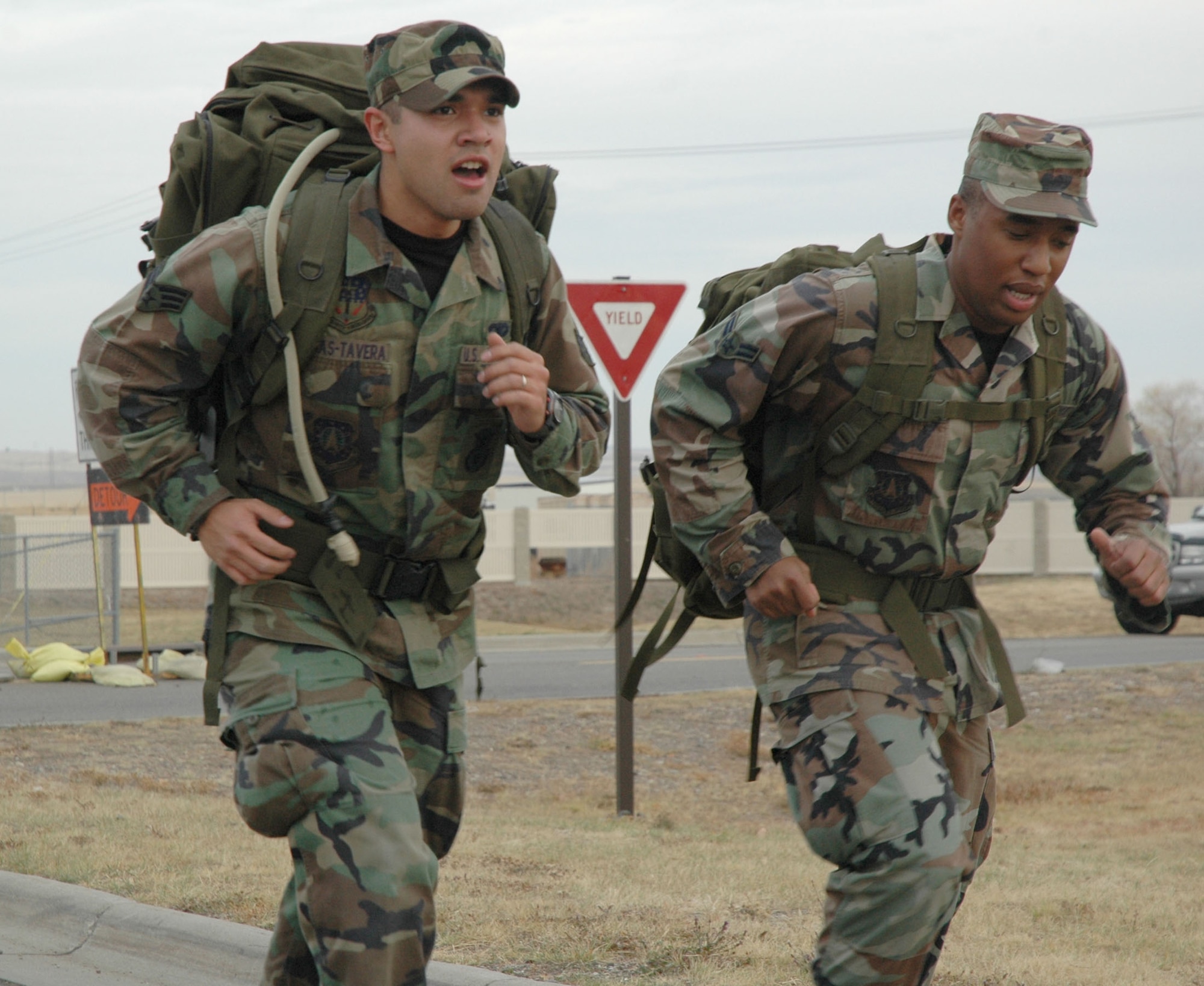 Senior Airman Brayam Rojas-Tavera and Airman 1st Class Travis Tabron, both from the 341st Missile Security Forces Squadron, participate in the “Remembrance Ruck” Nov. 9 at Malmstrom Air Force Base, Mont. Thirty-nine security forces members marched four miles with  30 pound backpacks, or “rucksacks” in tribute to the veterans who served their country in the armed services. (U.S. Air Force photo/Senior Airman Eydie Sakura)