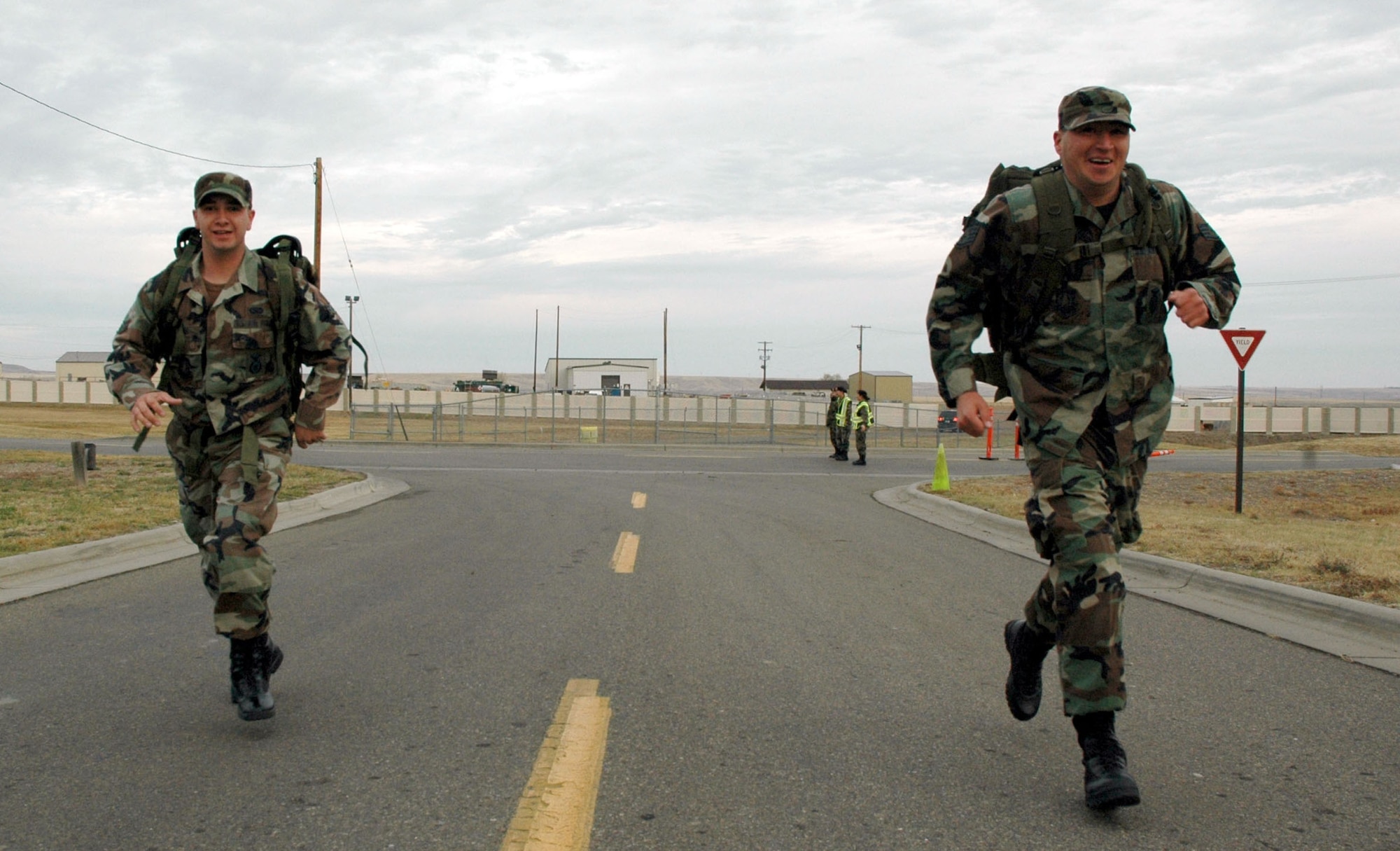 Airman 1st Class Bradley Doak and Staff Sgt. Joseph Tejada, both from the 341st Missile Security Forces Squadron, participate in the “Remembrance Ruck” Nov. 9 at Malmstrom Air Force Base, Mont. Thirty-nine security forces members marched four miles with  30 pound backpacks, or “rucksacks” in tribute to the veterans who served their country in the armed services. (U.S. Air Force photo/Senior Airman Eydie Sakura)
