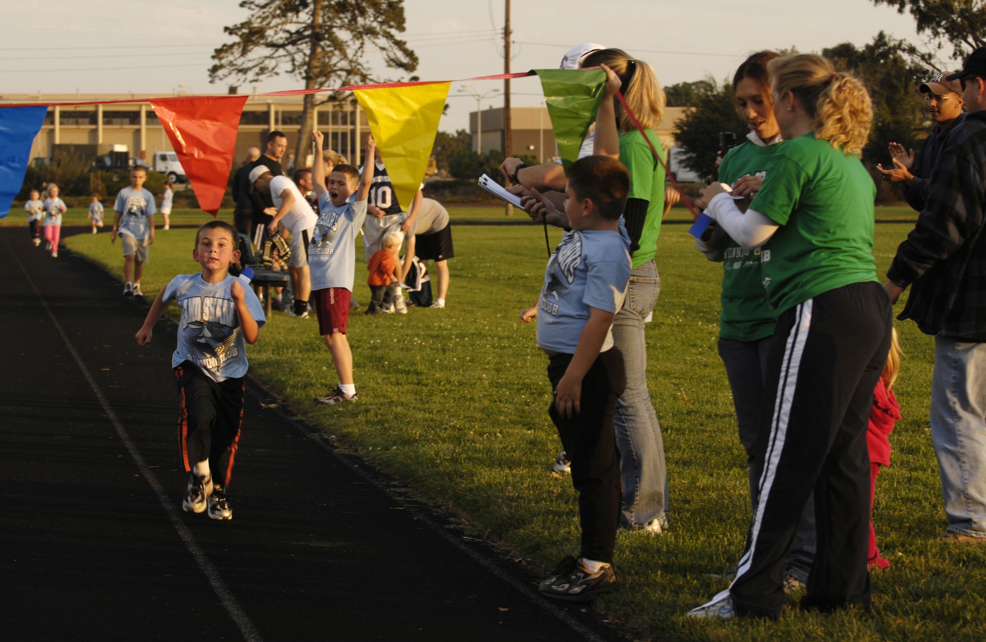 VANDENBERG AIR FORCE BASE, Calif. -- Trenton Lee, 7, runs toward the finish line after running four laps during the Land Sharks final track meet on Oct. 29. Each child that finishes a race gets a ribbon. (U.S. Air Force photo/Airman 1st Class Christian Thomas)