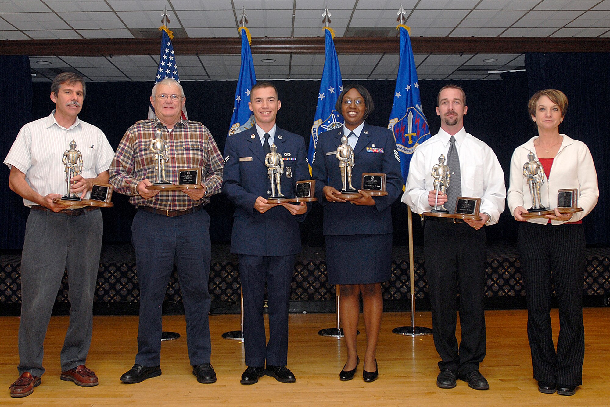 The 21st Space Wing held its quarterly awards ceremony Nov. 7 at The Club. Winners are (left to right):
Civilian supervisory category II: Kenneth Chalifour, 721st Mission Support Group, Cheyenne Mountain Air Force Station; Civilian supervisory category I: Lanny Eller, 21st Civil Engineer Squadron; Airman: Airman 1st Class Thomas Taylor, 21st Civil Engineer Squadron; Noncommissioned officer: Tech. Sgt. Lashawna Harn, 21st Dental Squadron; Civilian category II: Christopher Denz, 21st Space Communications Squadron; Civilian category I: Linda Cook, 21st Comptroller Squadron; Senior noncommissioned officer: Master Sgt. Michael Young(not pictured), 6th Space Warning Squadron, Cape Cod AFS; Company grade officer: 1st Lt. Israel Abensur (not pictured), 7th Space Warning Squadron, Beale AFB. (U.S. Air Force photo by Dennis Howk)