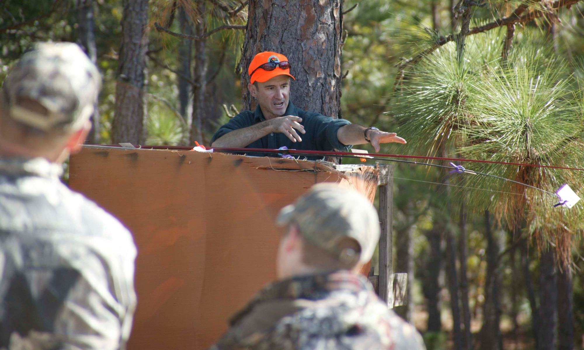 Poinsett Range, S.C.-- Hunters gather around Ronnie June, Natural and Cultural Resources wildlife manager, during a safety brief Nov. 10. Fifteen children from South Carolina and their parent or guardian participated the annual youth deer hunt held by Shaw Air Force Base and the Department of Natural Resources. (U.S. Air Force photo/Senior Airman Holly Brown.)