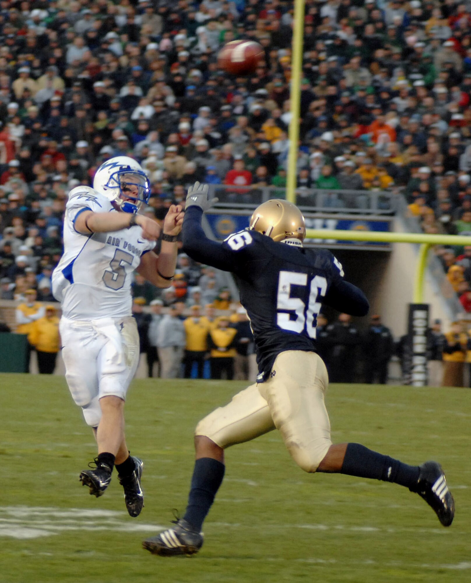 U.S. Air Force Academy Falcons quarterback Shaun Carney throws over Irish linebacker Kerry Neal during the Air Force Academy's 41-24 win over Notre Dame Nov. 10 at Notre Dame Stadium in Indiana. (Courtesy photo by Vanessa Gempis)
