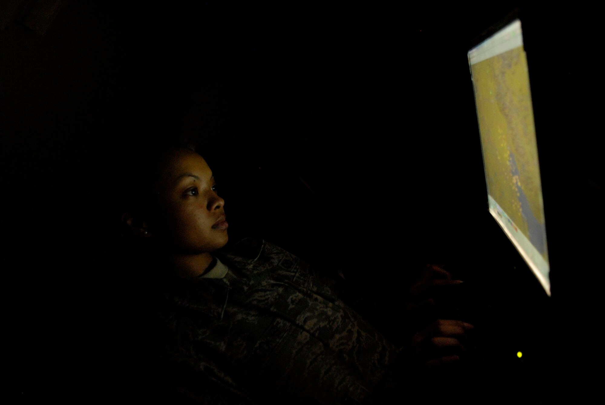 BALAD AIR BASE, Iraq -- Senior Airman Gwen Brookins, a 727the Expeditionary Air Control Squadron interface control technician, uses a multi-source correlator tracker to configure a radar feed ensuring she is able to monitor aircraft operations. Also known as Kingpin, the 727th EACS is responsible for maintaining positive control over aircraft operating in Iraq's 277,000 miles of airspace. (U.S. Air Force photo/Staff Sgt. Joshua Garcia)