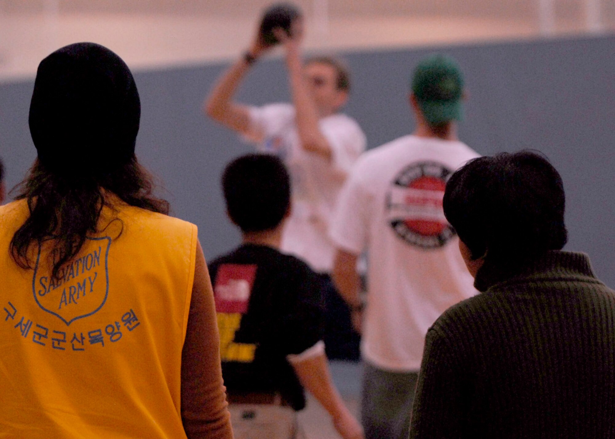 KUNSAN AIR BASE, South Korea— Spectators watch Airmen from the 8th Fighter Wing and local nationals play dodge ball at the fitness center here Nov 10. The Good Neighbor Program is designed for the base to actively engage with the local community to strengthen ties (U.S. Air Force photo/Staff Sgt. Araceli Alarcon)

