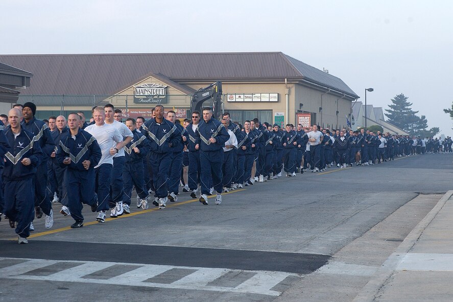 KUNSAN AIR BASE, South Korea --  Members of the 8th Fighter Wing, participate in the wing fun run here Nov. 13. The run, which also was a part of the wing's wingman day,  was designed to build esprit de corps and improve the state of physical readiness of the Wolf Pack Airmen. (U.S. Air Force photo/Senior Airman Giang Nguyen)                               