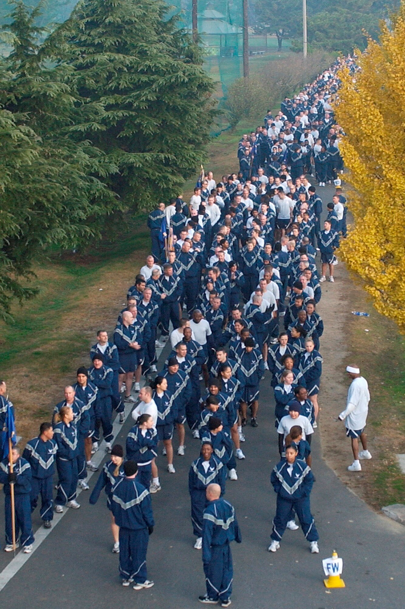 KUNSAN AIR BASE, South Korea --  Airmen from the 8th Fighter Wing line up in formation to prepare for the wing' fun run here Nov. 13. The event kicked off Kunsan's Wingman Day. The run was desgined to help build esprit de corps and improve the state of physical readiness of the Wolf Pack Airmen. (U.S. Air Force photo/Senior Airman Giang Nguyen)                               
