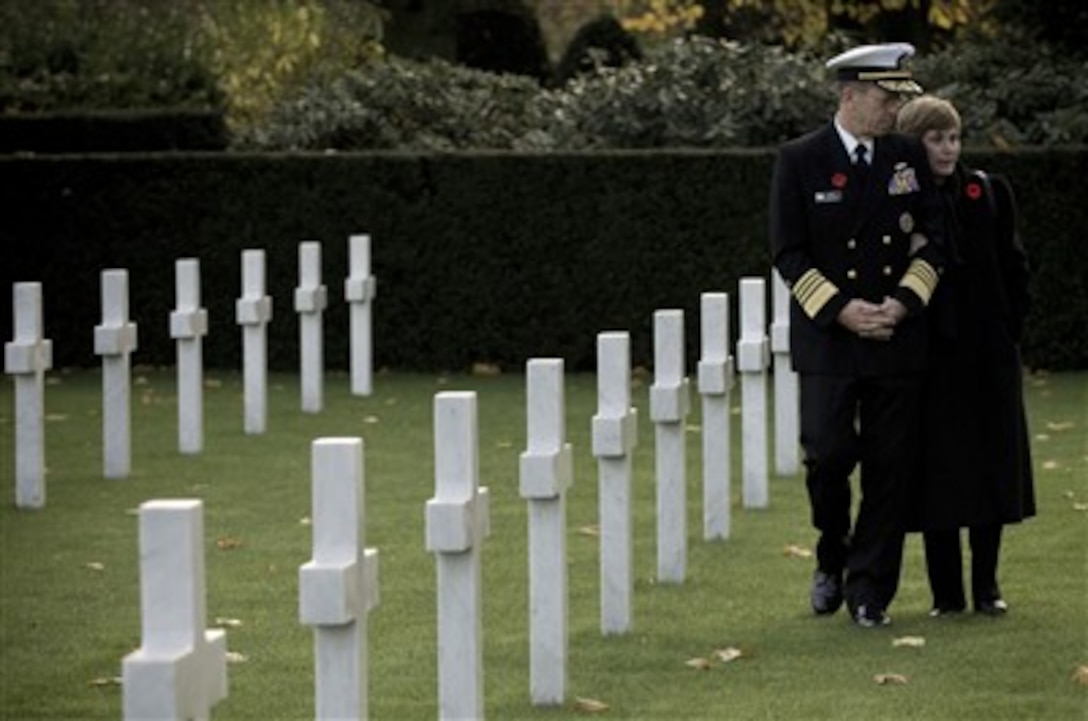 Chairman of the Joint Chiefs of Staff Adm. Mike Mullen, U.S. Navy, and his wife Deborah honor American dead on Veterans Day at Flanders Field American Cemetery and Memorial in Waregem, Belgium, on Nov. 12, 2007.  Flanders Field was established as a temporary battlefield cemetery in 1918 and is the smallest of eight permanent World War I military cemeteries on foreign soil.  