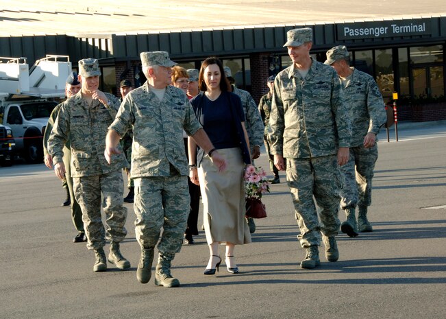 Col. John "Red" Millander, his wife Deb, and the departure party walk Gen. Arthur Lichte to his plane on Charleston AFB November 10. (U.S. Air Force photo/Airman 1st Class Katie Gieratz)