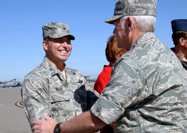 Gen. Arthur Lichte, AMC commander, is greeted by Col. John Michel, 437th Airlift Wing vice commander, on Charleston Air Force Base, S.C., Nov. 9. (U.S. Air Force photo/Airman 1st Class Katie Gieratz)