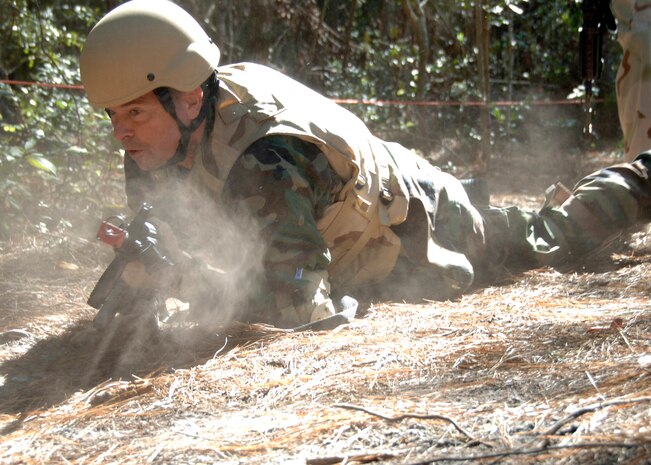 Col. John Michel, 437th Airlift Wing vice commander, performs the rush and roll movement technique at the Expeditionary Combat Skills Training on Charleston AFB Nov. 7 in preparation for his deployment in support of Operation Iraqi Freedom. (U.S. Air Force photo/Airman 1st Class Katie Gieratz)