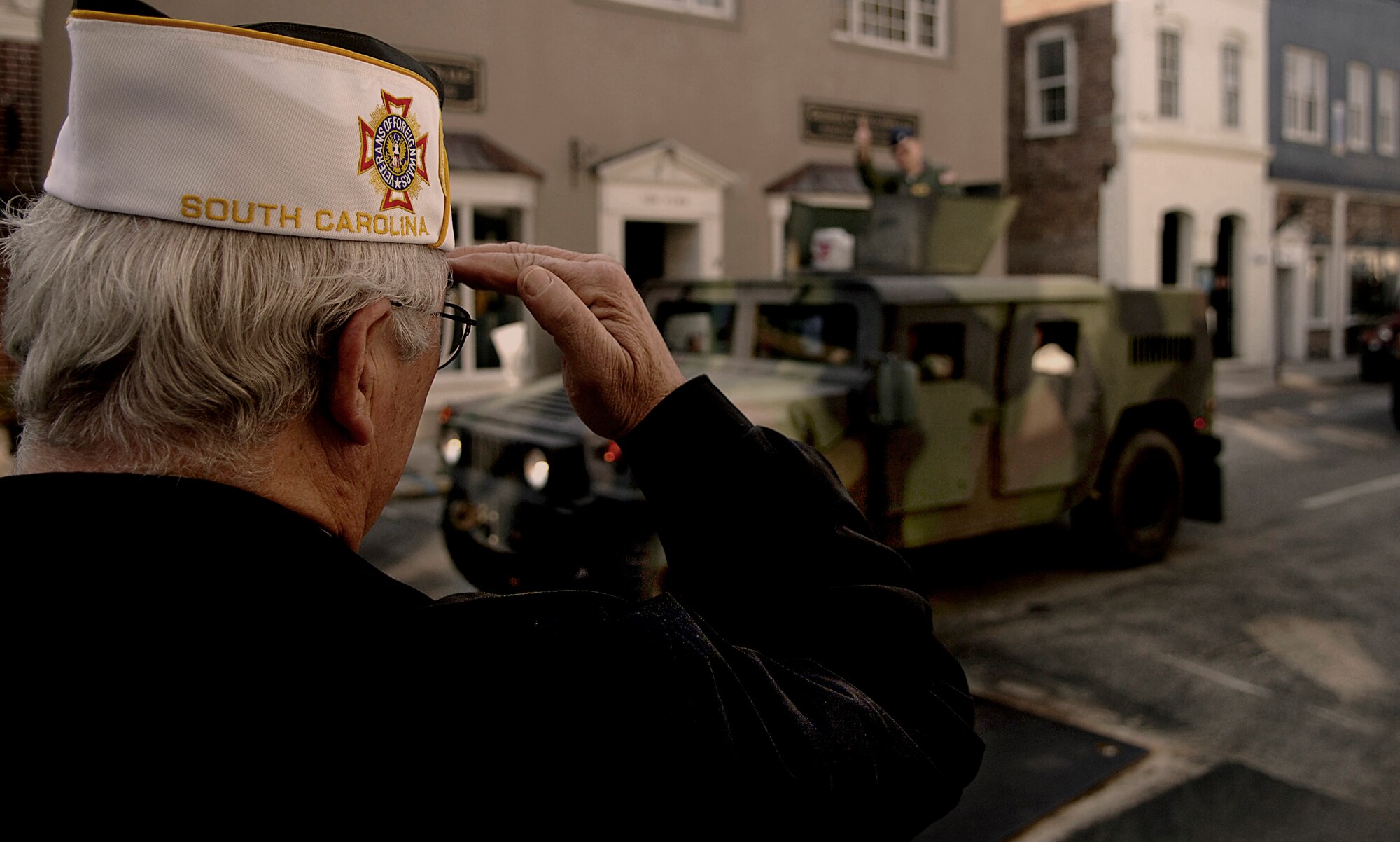Herold Stein, a former C-124 pilot from Charleston, S.C., salutes Col. John "Red" Millander, 437th Airlift Wing commander, during the Veterans Day Parade in downtown Charleston Nov. 11. More than 120 Airmen from the 437th and 315th Airlift Wings participated in the Ralph H. Johnson V.A. Medical Center Veterans Day Parade. (U.S. Air Force photo/ Senior Airman Nicholas Pilch)