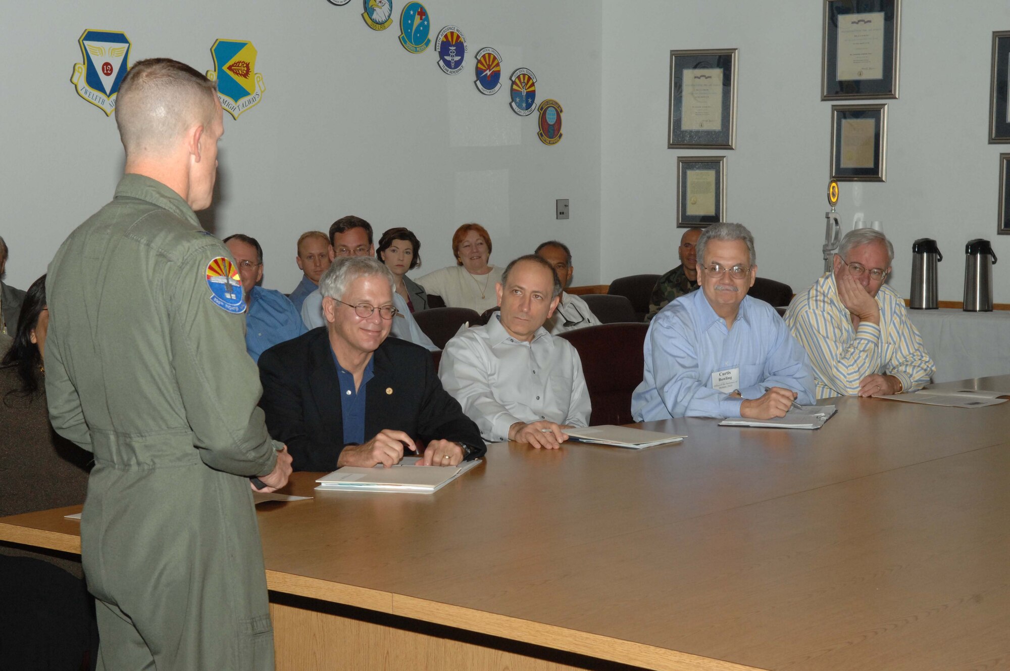 Colonel Kent Laughbaum, 355th Fighter Wing commander, speaks to members of the Western Regional Partnership here Nov. 8. The purpose of the visit was for members to become familiar with the mission and vision of the 355th Fighter Wing. (U.S. Air Force photo by Airman 1st Class Noah R. Johnson)