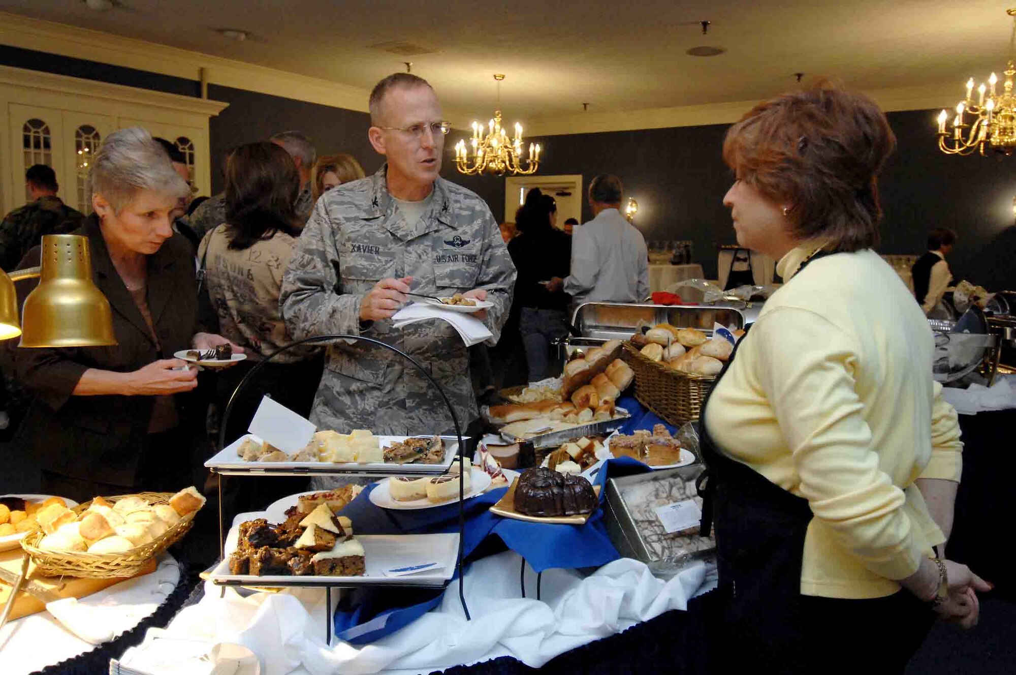 SHAW AIR FORCE BASE, S.C. -- Ms. Ginny Shirley, 20th Fighter Wing Protocol, and Col. Francis Xavier, 20th Mission Support Group commander, sample various desserts during a taste panel at the Carolina Skies Club, Nov. 14. Chefs at Carolina Skies prepared new menus of appetizers, hors d'oeuvres, main course dishes and desserts to be reviewed by senior leadership. Items receiving the highest marks will be added to the Carolina Skies menu. (U.S. Air Force photo/Airman 1st Class Kathrine McDowell)