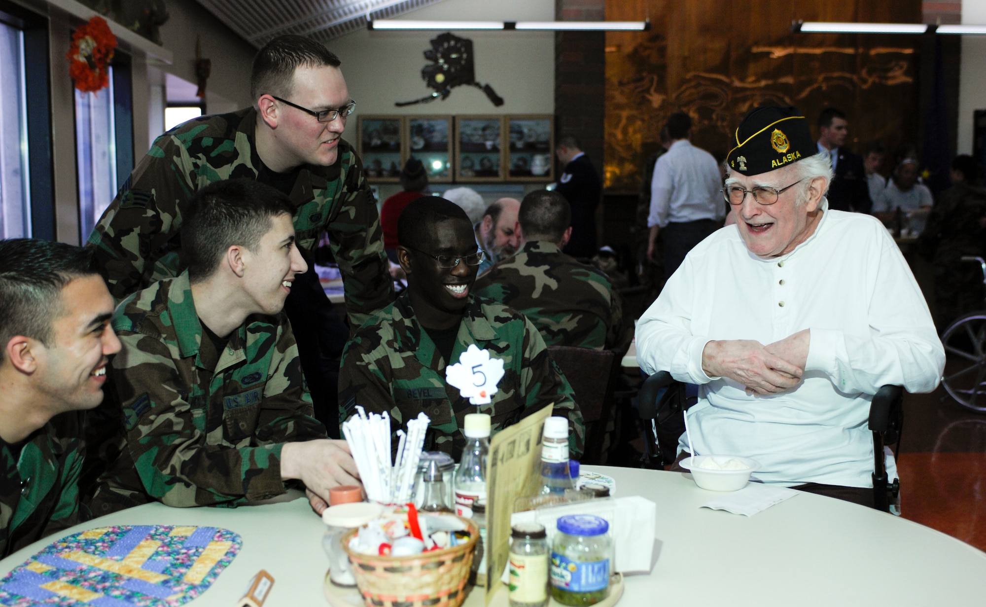 ANCHORAGE, Alaska -- Members of the 3rd Communication Squadron listen to David Pree talk about his military days during the Veteran Appreciation Celebration at the Pioneer Retirement Home Nov. 9, 2007. Mr. Pree enlisted in the Army Air Corps and was still active when it became the U.S. Air Force in 1947. (U.S. Air Force photo by Airman 1st Class Tinese Treadwell)